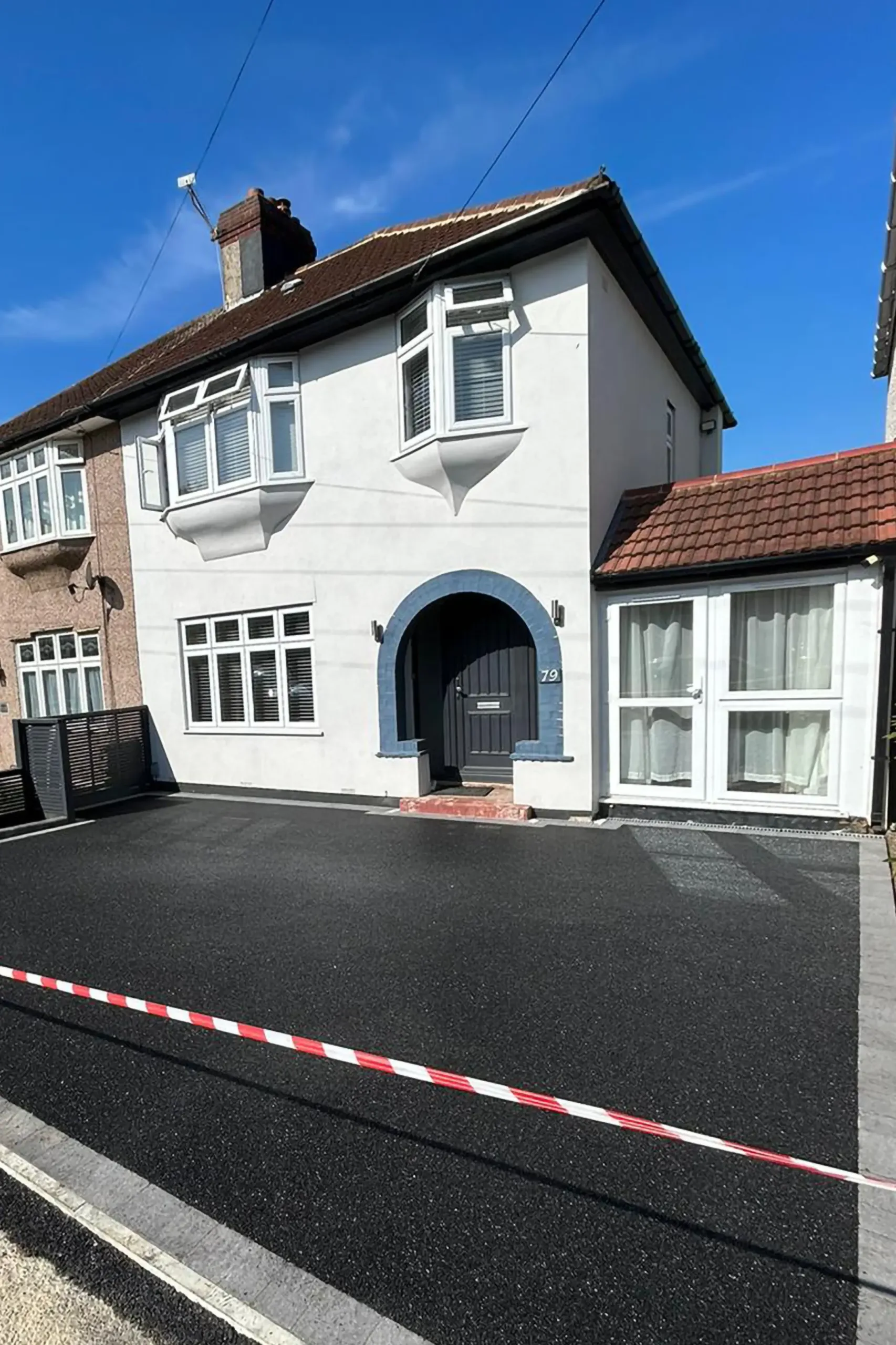 Tarmac Driveway by London Landscape and Driveway Team Ltd. - a smooth and durable solution for your driveway needs.